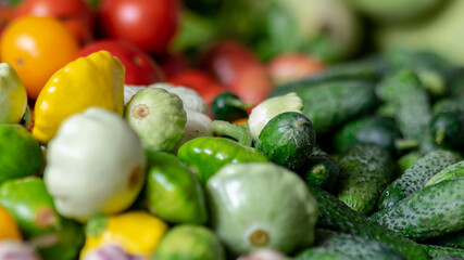 color photo with autumn vegetables on the table, different colors, shapes and types of vegetables prepared for home canning, autumn harvest time