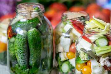 glass jars with different colors, types, shapes of vegetables, vegetables prepared for home canning, autumn harvest time