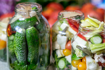 glass jars with different colors, types, shapes of vegetables, vegetables prepared for home...