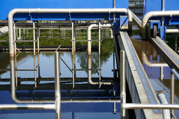 Wastewater treatment plant (Kläranlage) in germany, blue steel construction with pipes and rails....