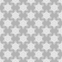 seamless pattern with snowflakes on grey background 