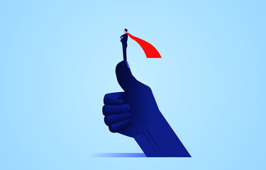 The concept of success and confidence, a successful businessman in a red cape standing on a giant thumb