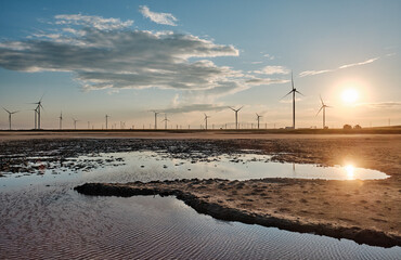 Wind stations on the background of sunset