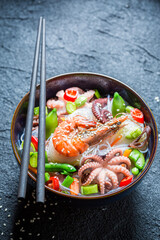 Spicy seafood noodle with prawn and octopus. Asian cuisine.
