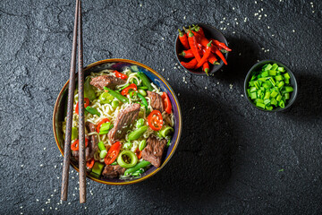 Tasty asian noodle with vegetables and beef. Asian cuisine.