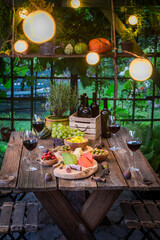 Evening dinner with cheese and wine Evening garden meeting.