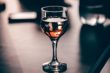 Glass of red wine in the sunset.