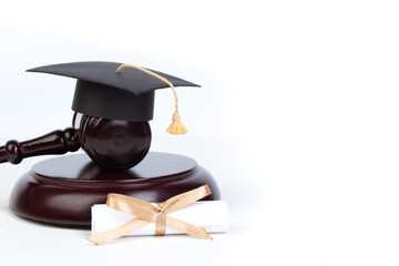 Graduation Hat with Diploma,Judge gavel on white background.