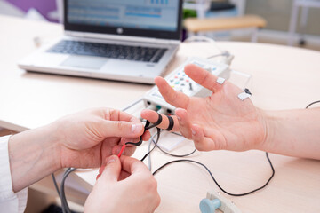 Patient nerves testing using electromyography at medical center