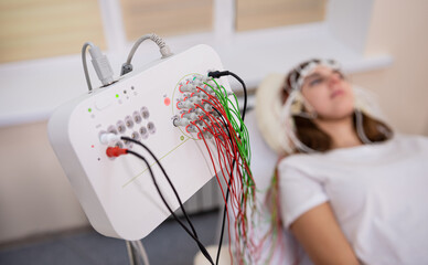 Patient brain testing using encephalography at medical center