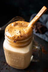 
Dalgona coffee, a refreshing coffee drink perfect for summer days. Coffee, milk, sugar and ice. Drink photography