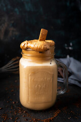 
Dalgona coffee, a refreshing coffee drink perfect for summer days. Coffee, milk, sugar and ice. Drink photography