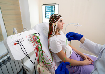 Patient brain testing using encephalography at medical center