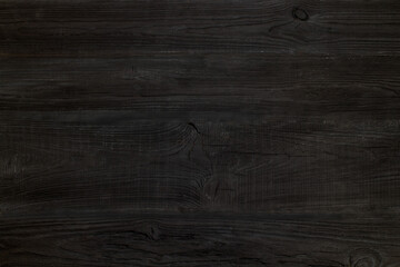 black Wood texture background. Hardwood, wood grain, organic material grunge style. Vintage wooden surface top view. Wooden table top view. Copy space for text.