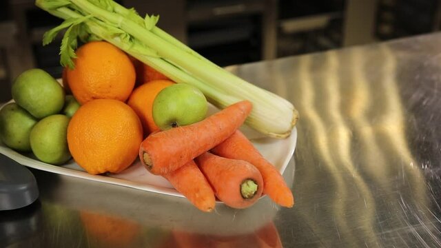 juicer and fresh fruits with vegetables
