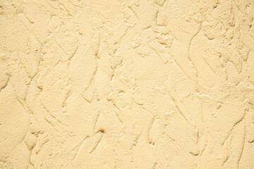 beige color plaster textured wall background surface simple mock up picture soft focus concept with empty copy space for your text here