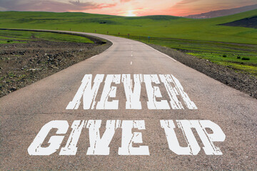 Never Give Up written on rural road