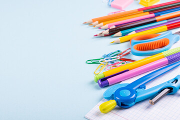 School supplies on a color background, table to view, copy space