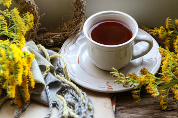A cup of tea among autumn plants.