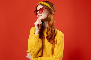 woman holding hair in red glasses fashion studio retro style