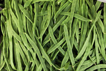 green romano beans on the counter in the market