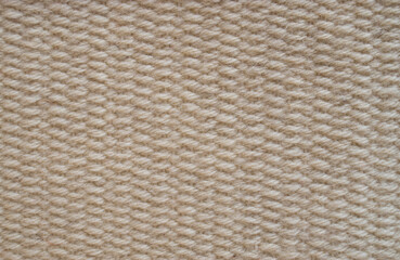 Woolen woven rug on a loom close