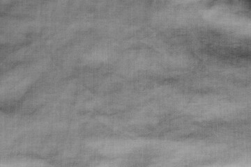 The texture of uneven natural cotton black fabric, abstract background.