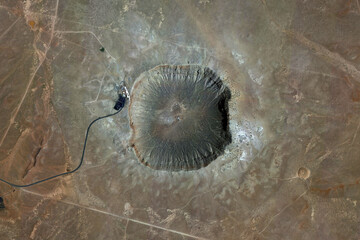 Barringer Meteor Crater looking down aerial view from above, bird’s eye view Barringer Crater,...
