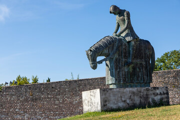 Assisi village in Umbria region, Italy. Statue of St. Francis. The town is famous for the most important Italian Basilica dedicated to St. Francis - San Francesco.