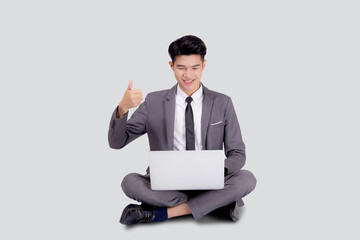 Young asian business man sitting work on laptop computer to internet online isolated on white background, businessman confident and notebook, freelance with success, marketing and communication.