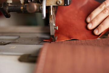 book binder restores old book in craft workshop