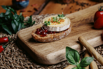 bruschetta and spices and herbs on table