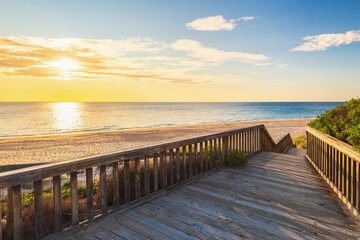 Boardwalk to O'Sullivan Beach with no people at sunset during a warm summer evening, South Australia