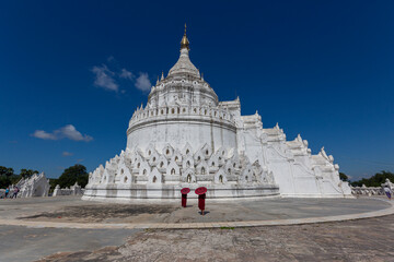 Mingun, Mandalay,Myanmar, November 16, 2021: Monks standing in temple Myanmar
