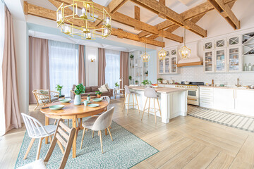 Fototapeta na wymiar modern expensive luxurious open-plan apartment. Rich Scandinavian-style interior with wooden beams on the ceiling in pastel colors