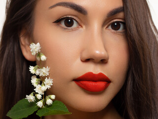 Close-up beauty of female face withevening make-up. Black arrows on the eyes and extremely long...