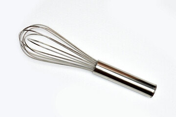 Flat lay(Top view) of Whisk isolated on white background view. Kitchen equipment. Close up view. Hobby cooking.