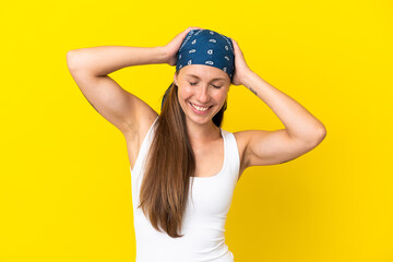 Young English woman isolated on yellow background laughing