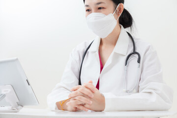 Doctor examine the patient via video call. Asian female doctor examines patients treatment,...