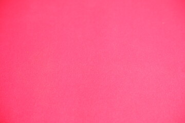Pink background. The texture of the cardboard.
