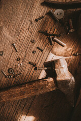 hammer and nails on wooden background