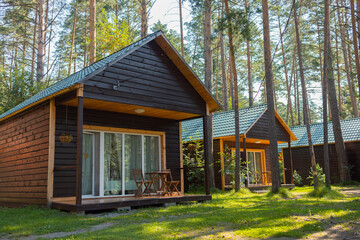 Beautiful tourist wooden houses. Tourist base. Beautiful veranda. Summer vacation.