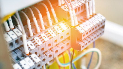 Open shield with wires of the control and measuring device at the production facility. Adjustment...