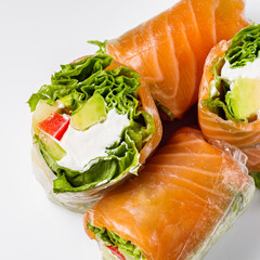appetizing spring rolls with sea food and philadelphia cheese on a white background