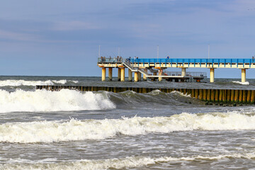 Pier in the city of Zelenogradsk during a storm. Waves in the Baltic Sea