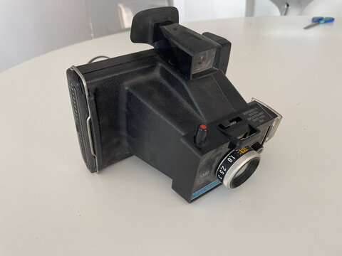 High-angle Shot Of A Black Polaroid Camera On The Table