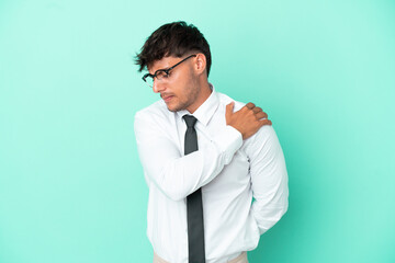 Business caucasian man isolated on blue background suffering from pain in shoulder for having made...