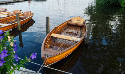 Fototapeta na wymiar Rowing boats out of wood on a lake