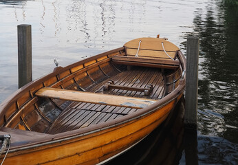 Rowing boat out of wood on a lake