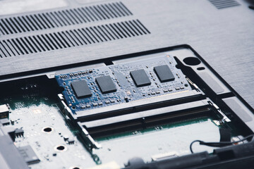 RAM (Random-access memory) in memory slot on the motherboard of laptop